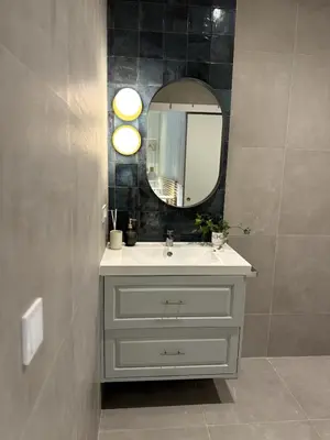 a bathroom with a sink and a mirror at Loft in Valencia, equipped and very well decorated in Valencia