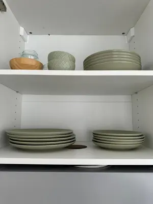 a closet filled with plates and bowls at Loft in Valencia, equipped and very well decorated in Valencia