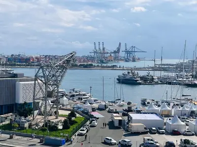 a marina with a bunch of boats in the water at Family Sea & Home Cabanyal in Valencia