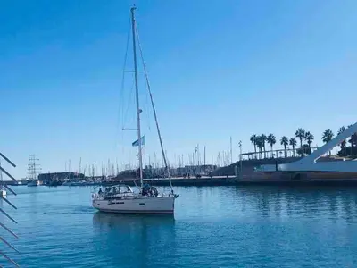 a sailboat sitting in the water in a harbor at Family Sea & Home Cabanyal in Valencia