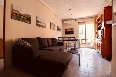 a living room with a couch and a table at 2 Bed Apartment, Great Location, 500M from Beach in Valencia