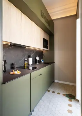 a kitchen with white cabinets and a counter top at Limehome Valencia de Xativa in Valencia