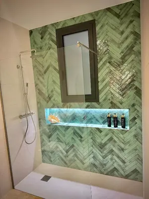 a bathroom with a shower with a mirror at Luxury apartment in Cabanyal in Valencia