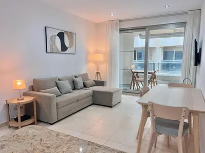 a living room with a couch and a table at Apartamento Mare Nostrum in Valencia
