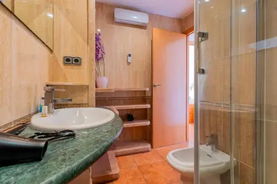 a bathroom with a sink and a toilet at Dictrict Key - Pobla de Farnals, Carabelas in Puebla de Farnals