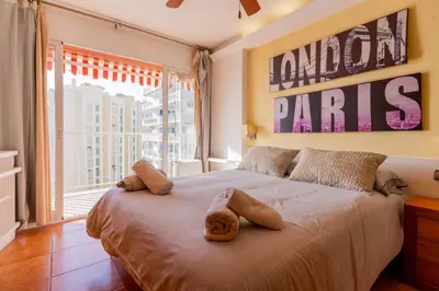 a bedroom with a large bed with two stuffed animals on it at Dictrict Key - Pobla de Farnals, Carabelas in Puebla de Farnals