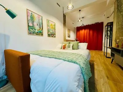 a bedroom with a large bed in a room at ORI A Cool & wide apartment next to historic center in Valencia