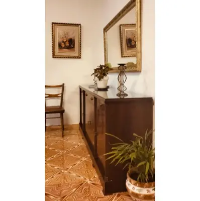 a room with a dresser and a mirror at El Almazán in Buñol
