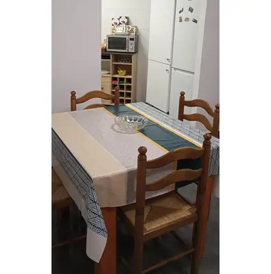 a dining room table with two chairs and a microwave at El Almazán in Buñol