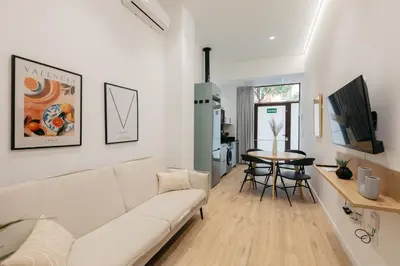 a living room with a couch and a table at Design loft in Valencia in Valencia