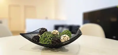 a black bowl of vegetables on a table at Vacansis Masamagrell Bajo Loft Tomas y Valiente in Masamagrell
