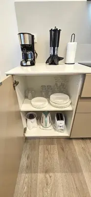 a white shelf with plates and appliances on it at Vacansis Masamagrell Bajo Loft Tomas y Valiente in Masamagrell