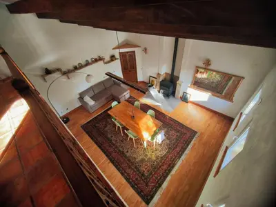 an overhead view of a living room with a table at Beautiful mountain chalet in Siete Aguas