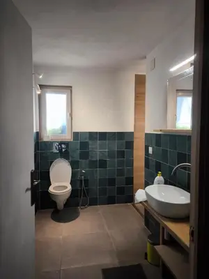 a bathroom with a toilet and a sink at Beautiful mountain chalet in Siete Aguas