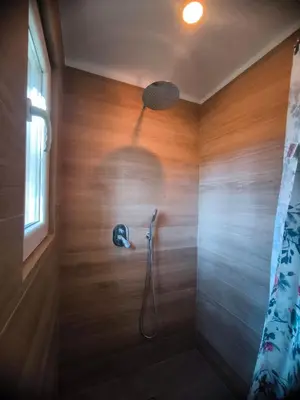 a bathroom with a shower with a shower head at Beautiful mountain chalet in Siete Aguas