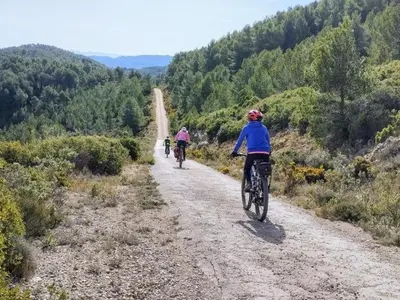 a group of people riding bikes down a dirt road at Beautiful mountain chalet in Siete Aguas