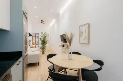 a small kitchen and dining room with a table and chairs at Elegant Loft in Valencia in Valencia