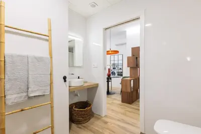 a bathroom with a sink and a mirror at Moderno loft reformado, Smart TV, AC, Beach, 3Pax in Valencia