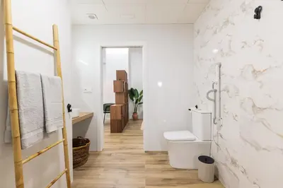 a bathroom with a toilet and a sink at Moderno loft reformado, Smart TV, AC, Beach, 3Pax in Valencia