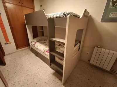 a bunk bed in a room with a bed at Apartment with views of the Mediterranean- Little Venice in Port Saplaya