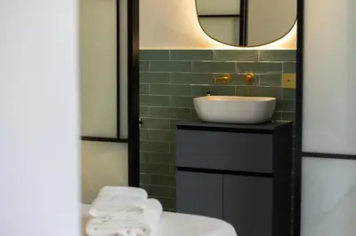 a bathroom with a sink and a mirror at Apartamento 4 Pax Vistas Torres de Serrano in Valencia