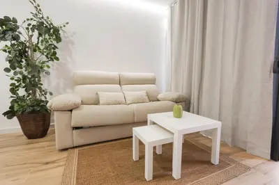 a living room with a couch and a table at ADapartments in Valencia