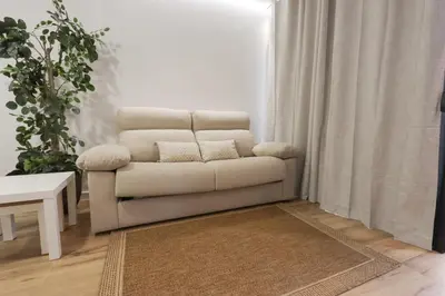 a living room with a couch and a table at ADapartments in Valencia