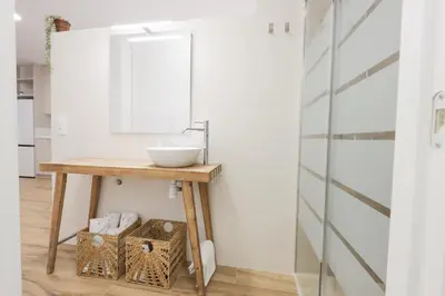 a bathroom with a sink and a mirror at ADapartments in Valencia