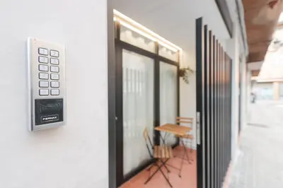 a door with a control panel on the side of a building at ADapartments in Valencia