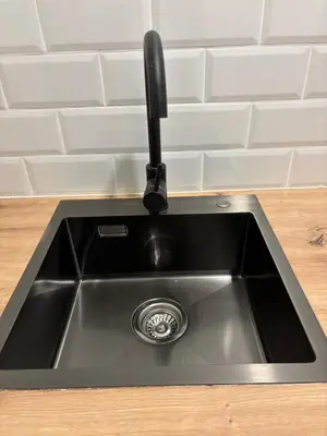 a kitchen sink with a faucet on top of it at Valencia City Scapes in Valencia