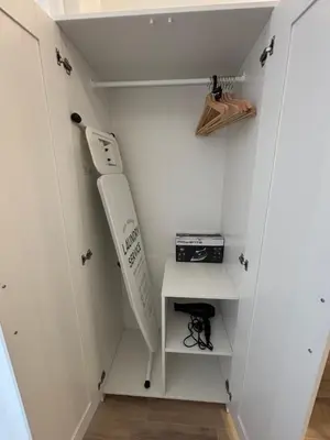 a closet with a baseball bat and a shelf at Valencia City Scapes in Valencia