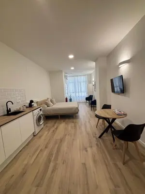 a living room with a couch and a table at Valencia City Scapes in Valencia