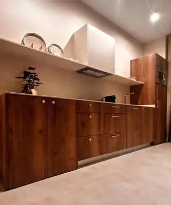 a kitchen with wooden cabinets and a hood at Pivote Flats-Playa B in Valencia