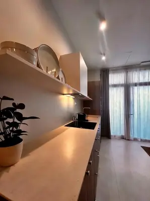 a kitchen with a counter with a sink and a window at Pivote Flats-Playa B in Valencia
