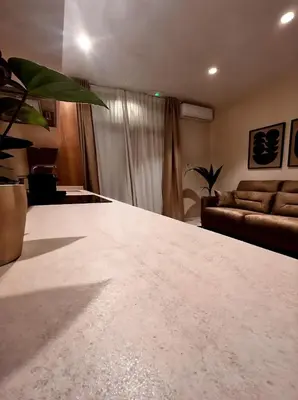 a living room with a large white counter top at Pivote Flats-Playa B in Valencia