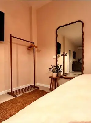 a bedroom with a bed and a large mirror at Pivote Flats-Playa B in Valencia