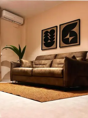 a brown leather couch in a living room at Pivote Flats-Playa B in Valencia