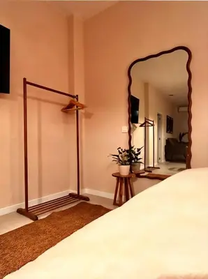 a bedroom with a bed and a large mirror at Pivote Flats-Playa A in Valencia