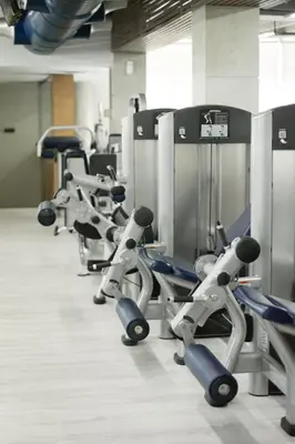 a row of exercise bikes lined up in a gym at Fitness & Spa, Suite Atalanta Valencia in Valencia