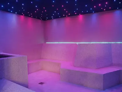 a room with pink lights on a wall at Fitness & Spa, Suite Atalanta Valencia in Valencia