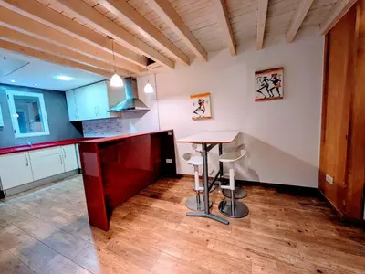a kitchen with a table and chairs in a room at Padre Luis flat in Valencia