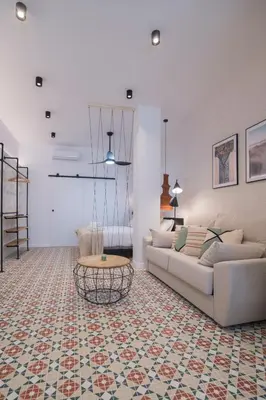 a living room with a couch and a table at District Key - Valencia, Fuencaliente D in Valencia