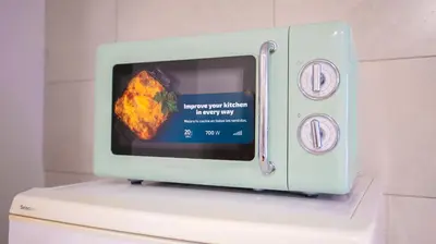 a microwave oven with a picture of a piece of food at LOWCOST Beach & CityCenter in Valencia
