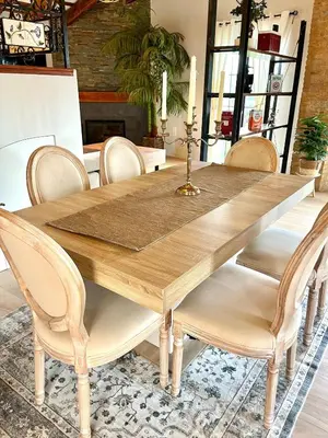 a dining room table with a wooden table and chairs at Luminoso loft boutique a 5 min del metro in Bétera