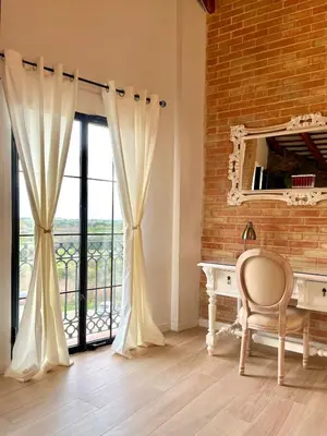 a room with a desk and a large window at Luminoso loft boutique a 5 min del metro in Bétera