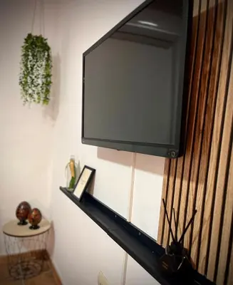 a flat screen tv hanging on a wall at Mar in Valencia