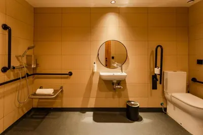 a bathroom with a toilet and a sink and a mirror at easyHotel Valencia Ciutat Vella in Valencia