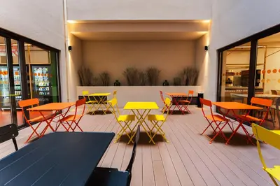 a hotel room with a bed and a tv at easyHotel Valencia Ciutat Vella in Valencia