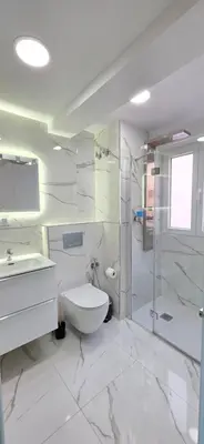 a white bathroom with a toilet and a shower at Paradise Home in Valencia