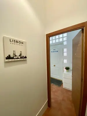 a hallway with a room with a sign on the wall at Alojamiento Familiar cerca de la Playa Valencia in Valencia